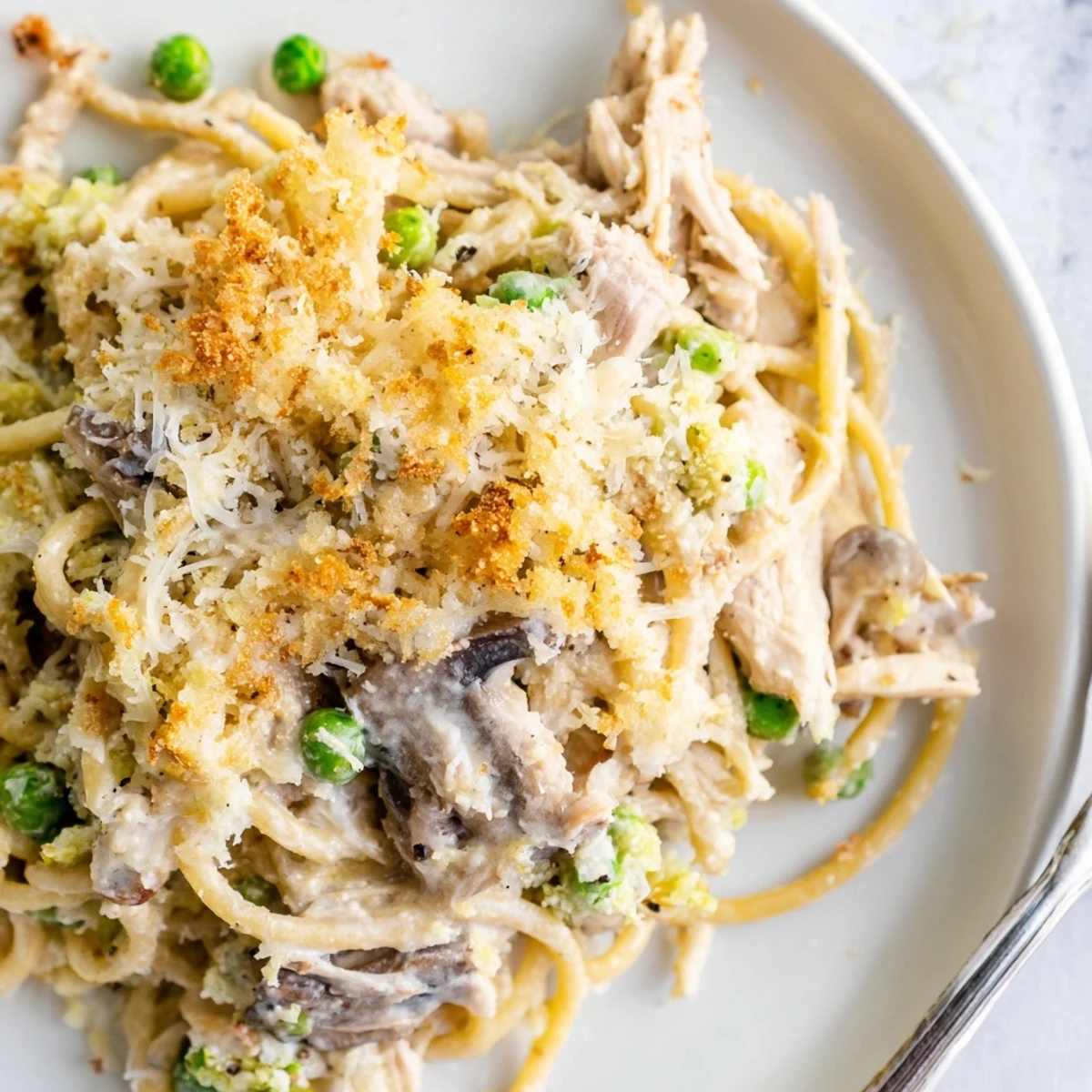 Golden-brown Turkey Tetrazzini casserole fresh from the oven with melted cheese and toasted panko topping.