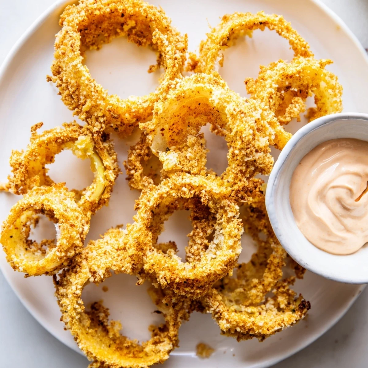 Crispy Air Fryer Onion Rings with Chipotle Mayo served hot and crunchy, perfect for game day.