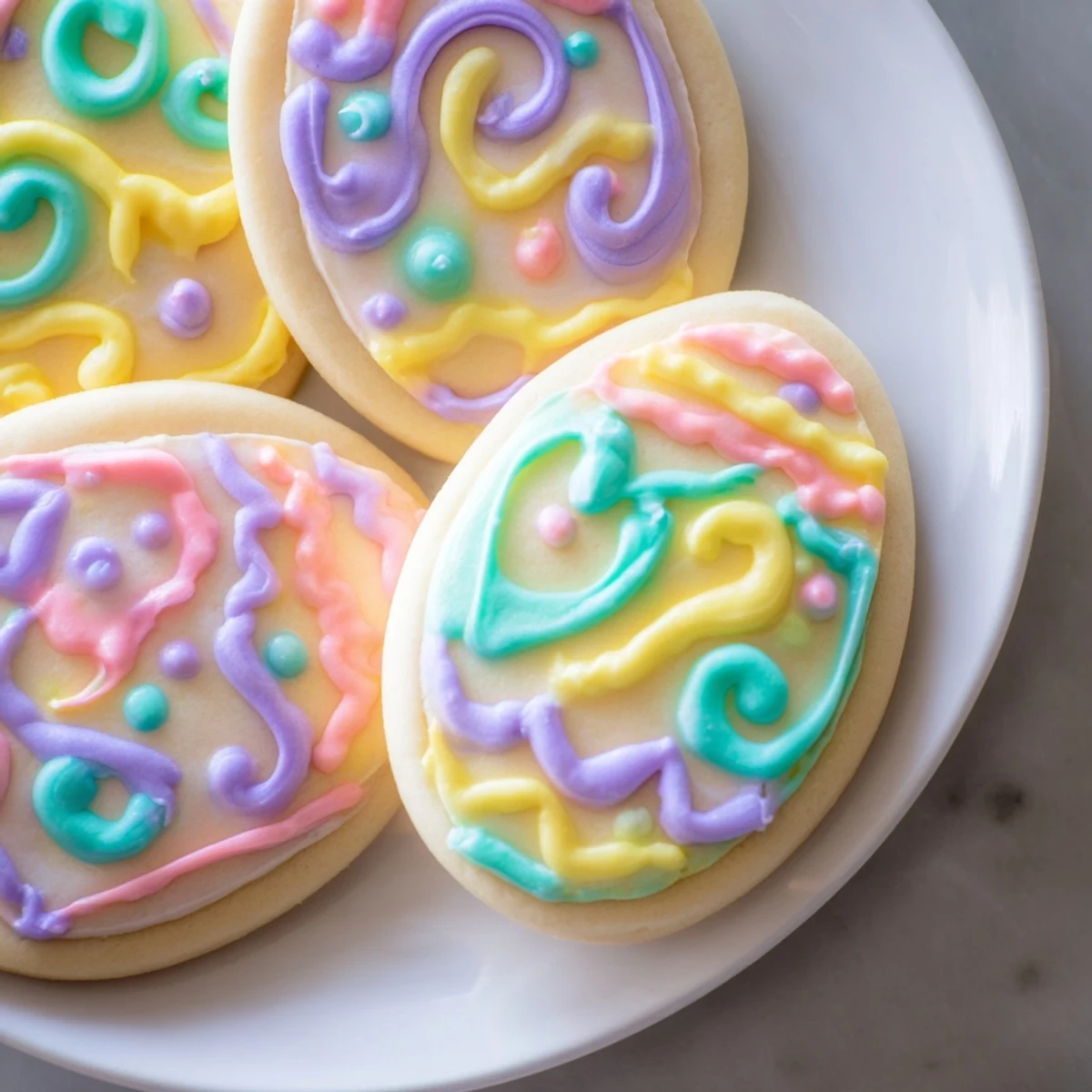 Buttery Easter Egg Sugar Cookies shaped like eggs, dusted with sugar and ready for a family dessert platter.