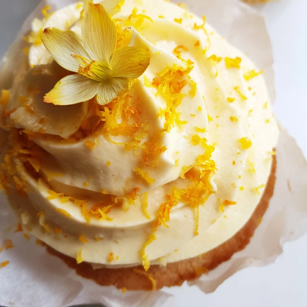 Delicate floral cupcakes infused with aromatic orange blossom water and swirled with light buttercream