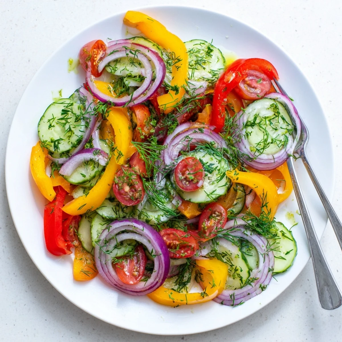 Vibrant cucumber and sweet pepper salad featuring crisp vegetables in light olive oil herb dressing