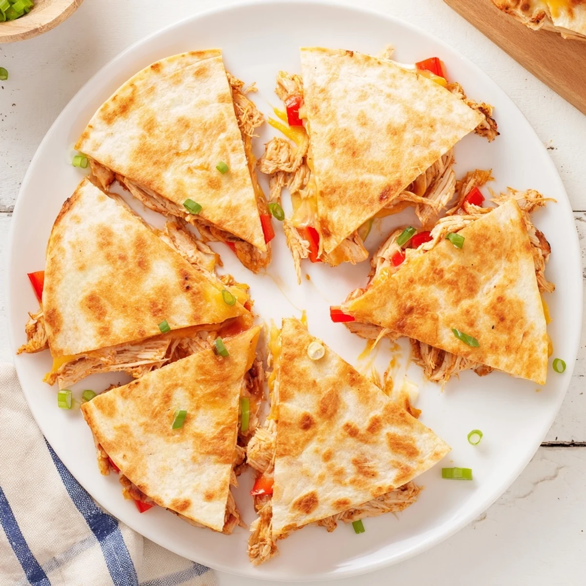 Golden baked chicken and cheese quesadillas with melted cheese and colorful bell peppers