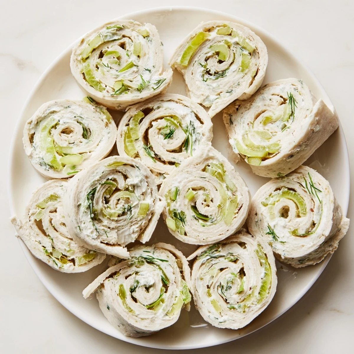 Fresh pickle dip pinwheels arranged on a serving platter for easy party appetizers