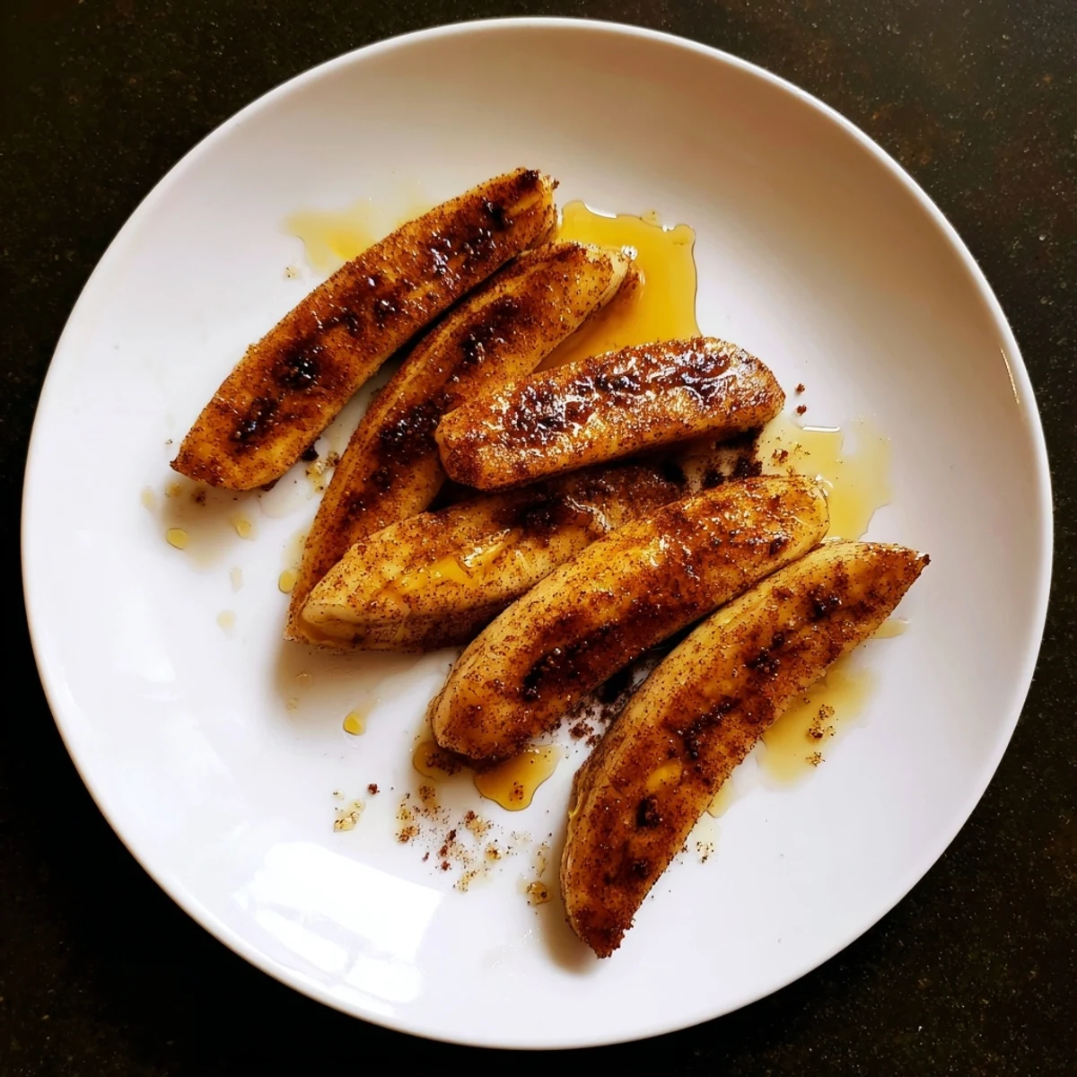 Sweet caramelized banana slices coated in warm cinnamon, served warm from the skillet