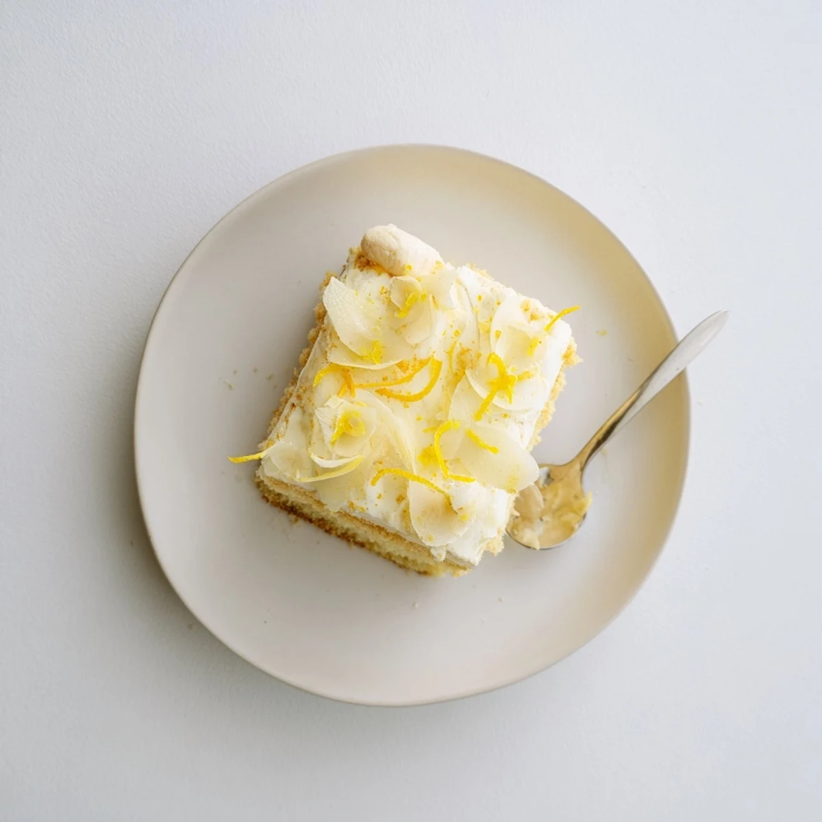 Creamy lemon tiramisu layered with syrup-soaked ladyfingers and fresh lemon zest