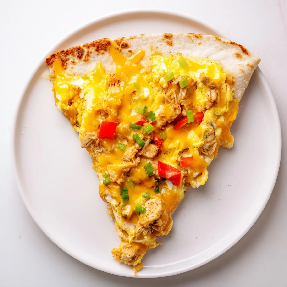 Chicken Breakfast Quesadilla with melting cheddar, golden tortillas, served with salsa