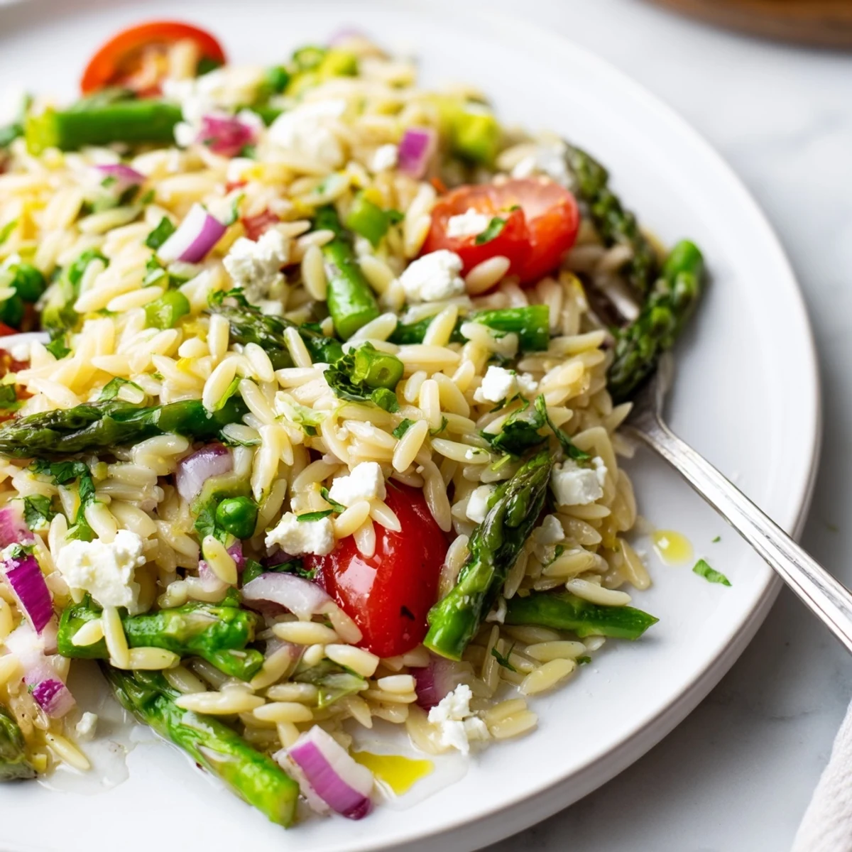 Asparagus Orzo Salad With Lemon Vinaigrette piled in bowl, bright citrus aroma  
