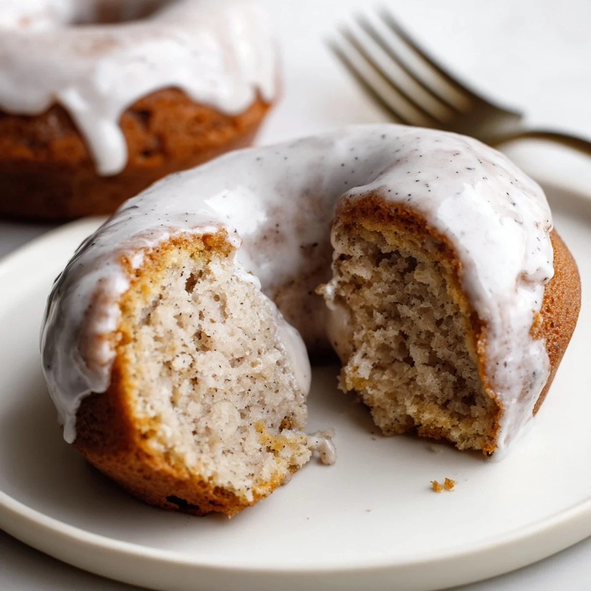 Fresh baked Banana Donuts on a wire rack, warm aroma of cinnamon