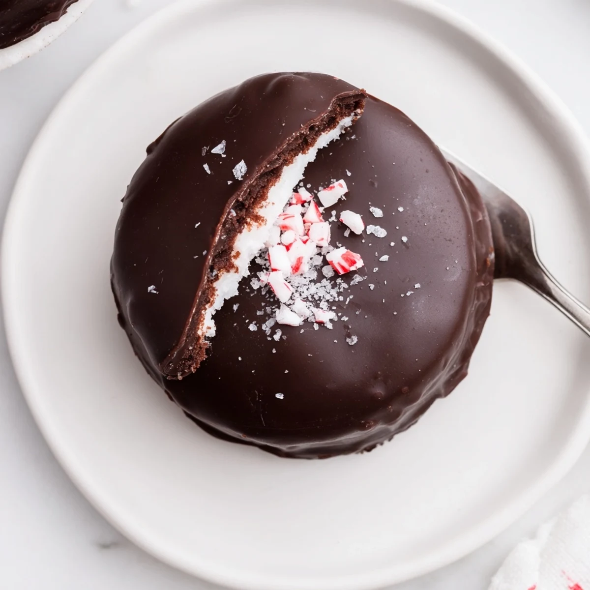 Peppermint Patties arranged on parchment, glossy dark chocolate and cool mint centers