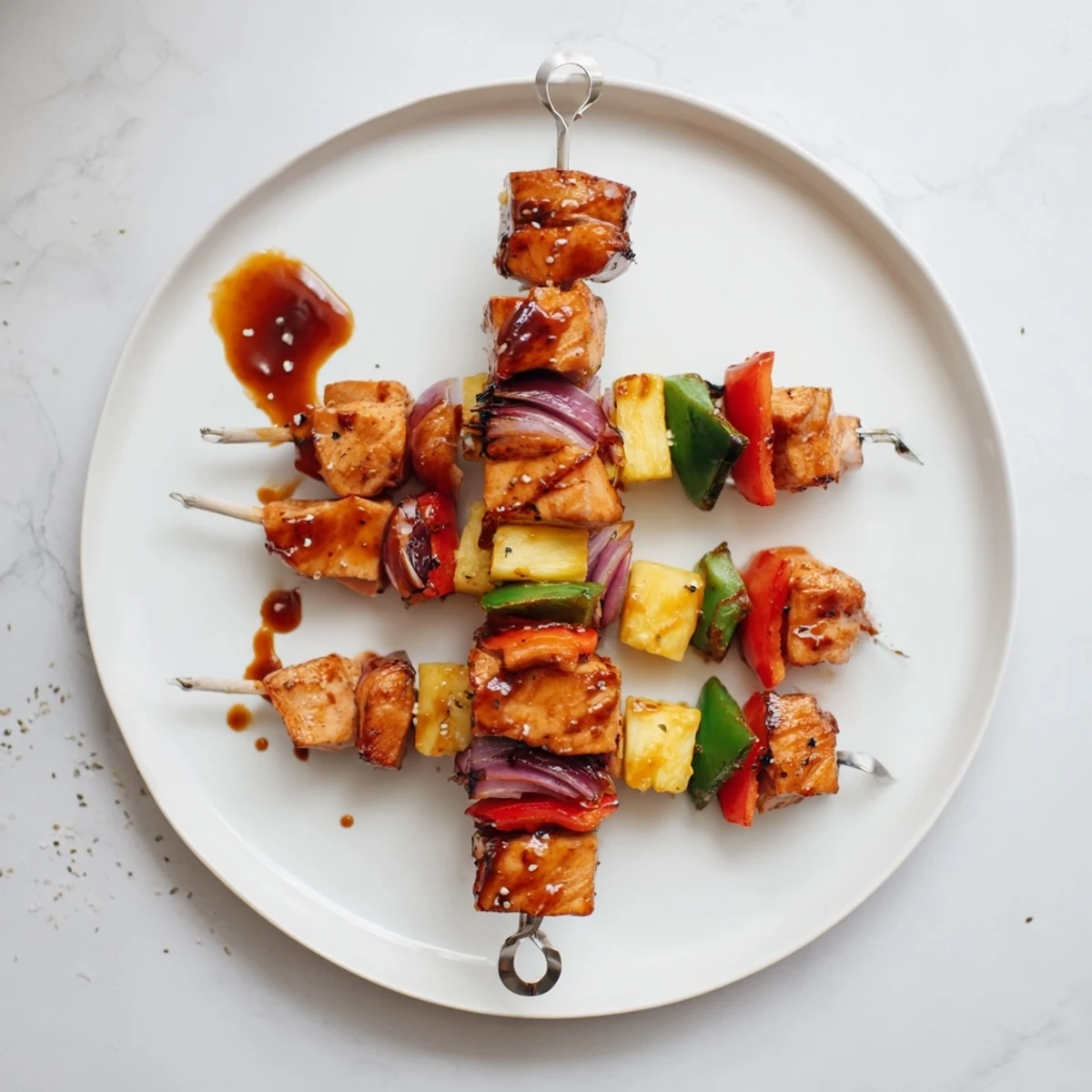 Grilled Bbq Pineapple Chicken Kabobs glazed with sticky sauce, served over rice