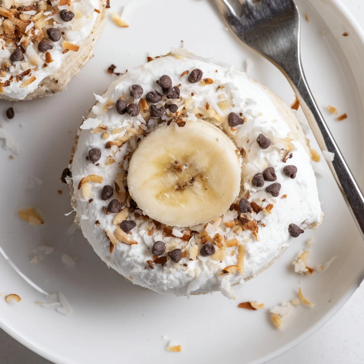 Handful of Frozen Banana Yogurt Bites on plate, slightly softened, snack-ready