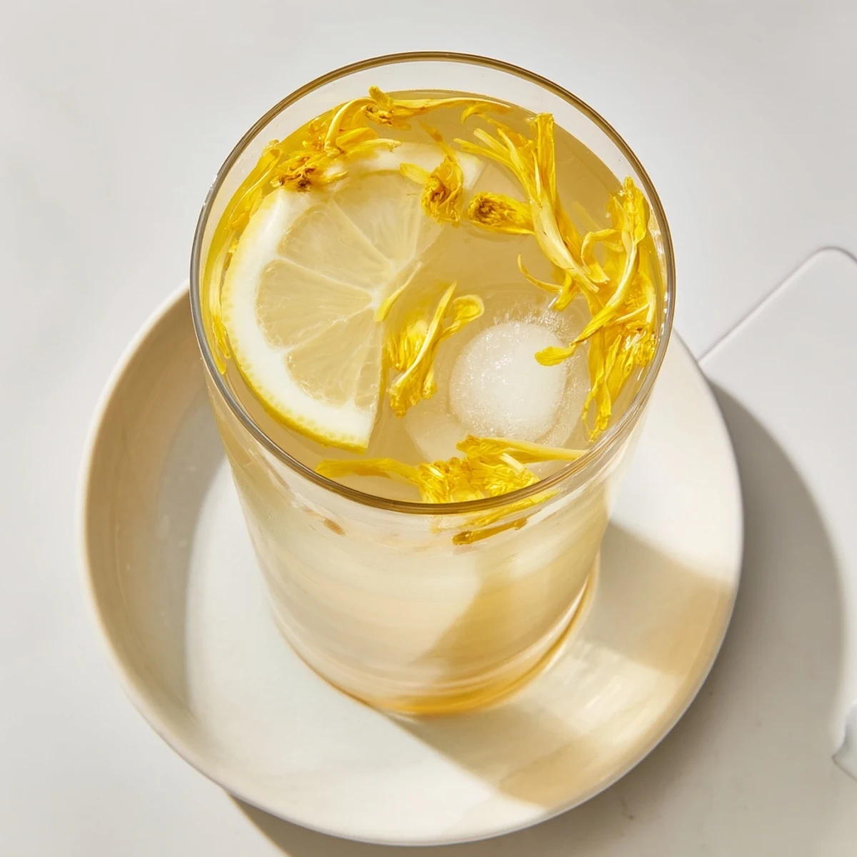 Homemade Dandelion Lemonade Recipe tastes floral and tart, served over ice