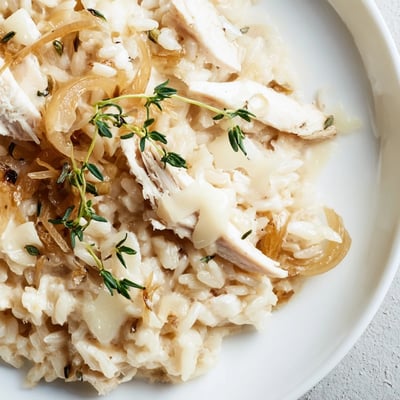 Creamy French onion chicken skillet served piping hot with caramelized onions and tender rice